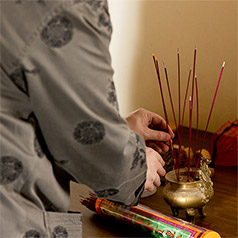 Burning incense at the altar at Chinese New Year 2023